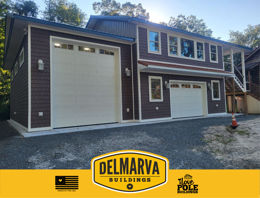 Dark gray and white two-bay garage with white doors and multiple windows by Delmarva Buildings.