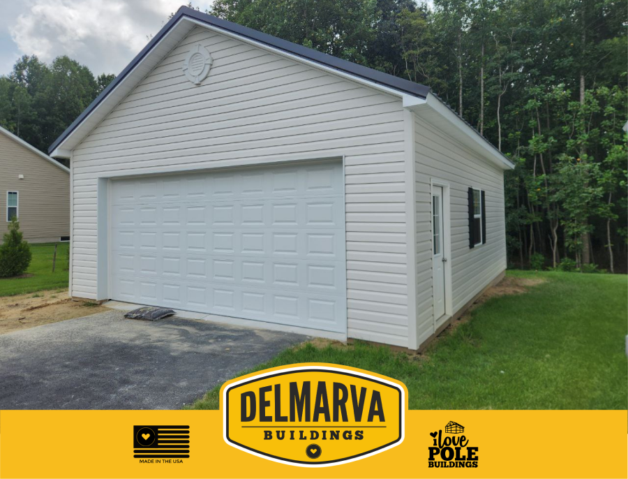 Cream-colored pole barn with a single white door garage built by Delmarva Buildings.