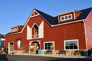 A huge red pole barn distillery